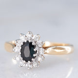 Anello a margherita vintage in oro giallo 9K con zaffiro (0.45ct ca.) e diamanti (0.10ctw ca.), anni ‘80