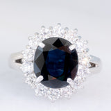 Anello a margherita vintage in platino con zaffiro (4.30ct) e diamanti (1.05ctw), anni ‘80