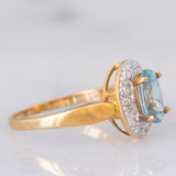 Anello a margherita in oro giallo 9K con zircone azzurro (1.83ct ca.) e zirconi bianchi