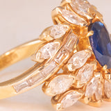 Vintage 18K yellow gold ring with sapphire (1.20ct approx.) and marquise and baguette cut diamonds (2.70ctw approx.), 70s