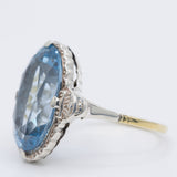 Anello da cocktail Art Déco in oro giallo 14K e argento con spinello azzurro (7.50ct ca.), anni ‘30