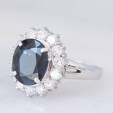 Anello a margherita vintage in platino con zaffiro (4.30ct) e diamanti (1.05ctw), anni ‘80