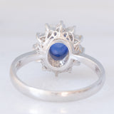 Anello a margherita vintage in platino con zaffiro (1.20ct) e diamanti (0.40ctw), anni ‘70/‘80