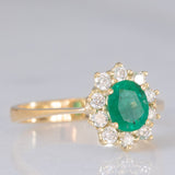 Anello a margherita vintage in oro giallo 18K e 14K con smeraldo (0.60ct ca.) e diamanti di taglio brillante (0.30ctw ca.), anni ‘70/‘80