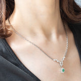 Collier vintage in oro bianco 18K con smeraldo (0.40ct ca.) e diamanti di taglio brillante (2.10ctw ca.), anni ‘80