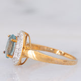 Anello a margherita in oro giallo 9K con zircone azzurro (1.83ct ca.) e zirconi bianchi