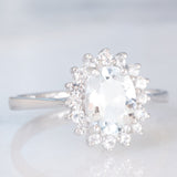 Anello a margherita in oro bianco 9K con acquamarina (1ct ca.) e diamanti di taglio brillante (0.16ctw ca.), anno 2006