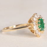 Bague marguerite en or jaune 14 carats avec émeraude (environ 0.70 ct) et diamants taille brillant (environ 0.80 ct), années 70