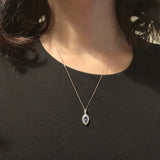 Ciondolo a margherita vintage in platino con tanzanite (0.81ct) e diamanti (0.37ctw)