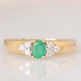 Vintage 9K yellow gold band ring with emerald (0.25ct approx.) and diamonds (0.12ctw approx.)