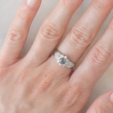 Vintage platinum daisy ring with color-change garnet (approx. 0.35ct) and diamonds (0.58ctw)