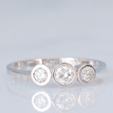 Vintage-Trilogie aus 14 Karat Weißgold mit Diamanten im Brillantschliff (ca. 0.26 Karat), 90er Jahre
