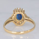 Anello a margherita vintage in oro giallo 14K con zaffiro (0.70ct ca.) e diamanti (0.20ctw ca.), anni ‘80
