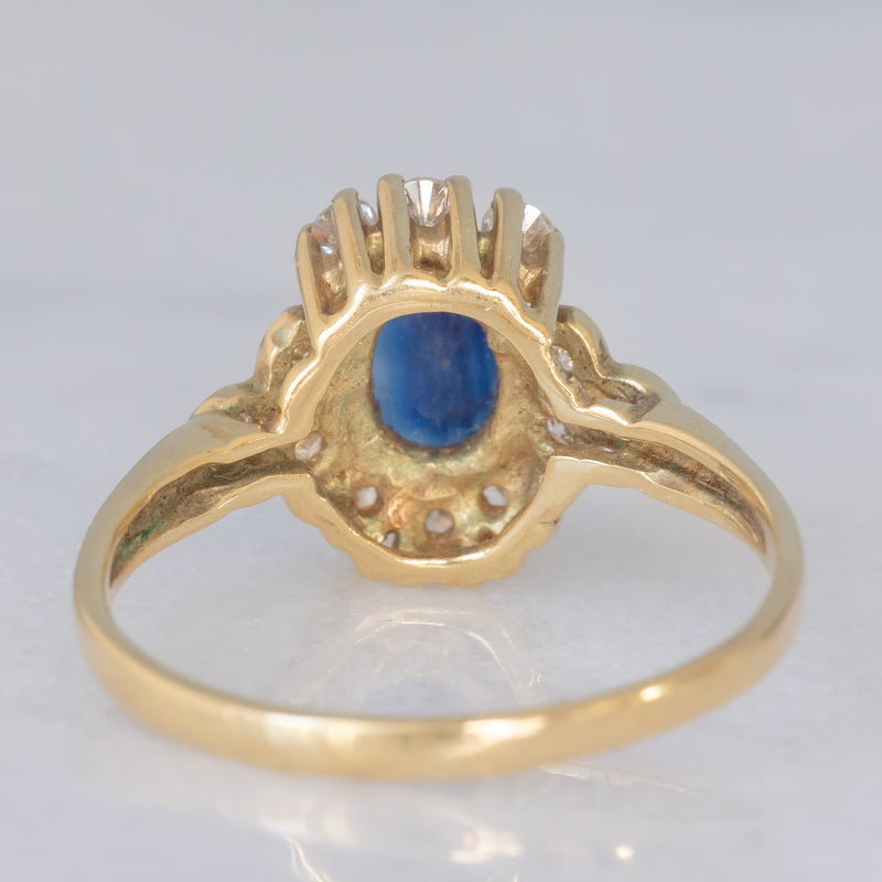 Anello a margherita vintage in oro giallo 14K con zaffiro (0.70ct ca.) e diamanti (0.20ctw ca.), anni ‘80