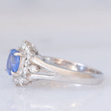 Anello margherita vintage in platino con zaffiro (0.75ct) e diamanti (0.31ctw), anni ‘80