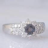 Vintage platinum daisy ring with color-change garnet (approx. 0.35ct) and diamonds (0.58ctw)