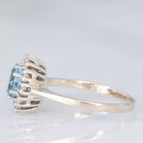 Bague marguerite vintage en or blanc 14 carats avec aigue-marine (environ 0.70 ct) et diamants taille brillant (environ 0.24 ct), années 70