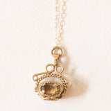 Vintage-Halskette mit drehbarem Anhänger aus 9-karätigem Gelbgold mit Quarz und Granat