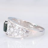 Anello a fascia in platino con tormalina verde (1.13ct) e diamanti (0.38ctw) e con lavorazioni a traforo, anni '90/anni '2000