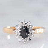Anello a margherita vintage in oro giallo 9K con zaffiro (0.45ct ca.) e diamanti (0.10ctw ca.), anni ‘80