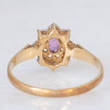 Anello a margherita vintage in oro giallo e bianco 9K con rubino (0.12ct ca.) e diamanti (0.04ctw ca.), anno 1988