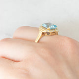 Anello vintage in oro giallo 14K con topazio azzurro (2.80ct ca.) e diamanti di taglio brillante (0.16ctw ca.), anni ‘80/‘90