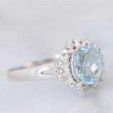 Anello a margherita vintage in platino con acquamarina (1.09ct) e diamanti (0.10ctw), anni ‘80/‘90