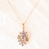 Vintage-Halskette mit Kette aus 9-karätigem Gelbgold und Anhänger aus 9-karätigem Gelbgold mit Tansaniten (ca. 0.48 ctw) und Diamanten, 80er/90er Jahre