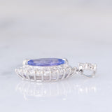 Ciondolo a margherita vintage in platino con tanzanite (0.81ct) e diamanti (0.37ctw)