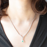 Collier vintage in oro bianco 18K con smeraldo (0.40ct ca.) e diamanti di taglio brillante (2.10ctw ca.), anni ‘80