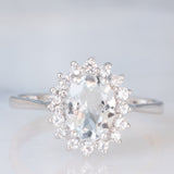 Anello a margherita in oro bianco 9K con acquamarina (1ct ca.) e diamanti di taglio brillante (0.16ctw ca.), anno 2006