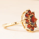 Vintage Gänseblümchen-Ring aus 8-karätigem Gelbgold mit Granaten (ca. 2 ctw), 50er/60er Jahre