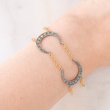 Vintage 18K yellow gold and silver semi-rigid bracelet with crescent-shaped decorations and rose-cut diamonds, 50s