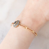Braccialetto semirigido retrò in oro giallo 14K a argento con zaffiro (1ct ca.) e diamanti di taglio rosetta (0.36ctw ca.), anni ‘40/‘50