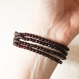 Vintage bracelet with four strands of garnets and 14K yellow gold beaded clasp, 50s/60s