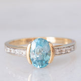 Anello in oro giallo 9K con zircone azzurro (1.63ct) e zirconi bianchi