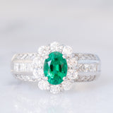Anello a fiore vintage in platino con smeraldo (0.81ct) e diamanti (0.93ctw), anni ‘80
