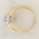 Anello a margherita vintage in oro giallo 9K con topazio azzurro (0.55ct ca.) e diamanti (0.05ctw ca.)