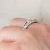 Anello a fascia vintage in platino con diamanti per un totale di 1.25ct (centrale di taglio princess 0.78ct), anni ‘80