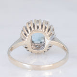 Anello a margherita vintage in oro bianco 14K con acquamarina (0.70ct ca.) e diamanti di taglio brillante (0.24ctw ca.), anni ‘70