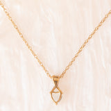 Vintage-Halskette mit Kette aus 9-karätigem Gelbgold und Anhänger aus 9-karätigem Gelb- und Weißgold mit blauem Topas im Herzschliff (ca. 0.60 ct), ca. 90er Jahre.