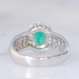 Anello a fiore vintage in platino con smeraldo (0.81ct) e diamanti (0.93ctw), anni ‘80