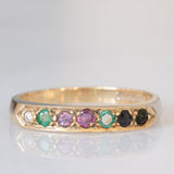 Anello “DEAREST” vintage in oro giallo 9K con diamante, smeraldi, ametista, rubino, zaffiro e tormalina, anno 1994