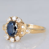 Anello a margherita vintage in oro giallo 14K con zaffiro (0.70ct ca.) e diamanti (0.20ctw ca.), anni ‘80