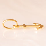 Collana con catenina in argento dorato e con tre ciondoli a forma di delfino in oro giallo 18K, di ancora in oro giallo 18K e di tartaruga in oro giallo 14K