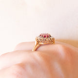 Antique 18K yellow gold daisy ring with synthetic ruby (1.60ct approx.) and rose cut diamonds (0.24ctw approx.), early 900s