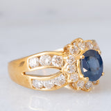 Un’alba sul mare - Anello vintage a fascia e a margherita in oro giallo 18K con zaffiro e diamanti
