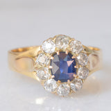 Anello a margherita antico in oro giallo 14K con zaffiro (0.40ct ca.) e diamanti di taglio vecchia miniera (0.70ctw ca.), anni ‘20/‘30