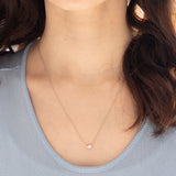 Collana vintage in platino con diamante di taglio smeraldo (0.30ct)