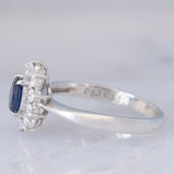 Anello a margherita vintage in platino con zaffiro (0.53ct) e diamanti (0.32ctw), anni ‘90